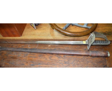 A Victorian/Edwardian sword and leather scabbard.  Condition Report: Scabbard is in poor condition and split.  Hilt is in poo