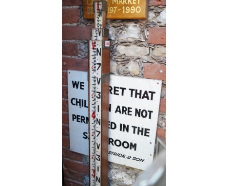 A vintage surveyor's measuring stick. 