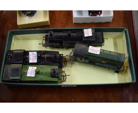 Four OO gauge locomotives, comprising: a Dock Shunter; a Hornby/Triang BR black Ginty Tank Engine; and two Lima Tank Engines.