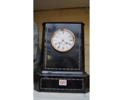 An ebonized and inlaid mantel clock, the circular enamel dial inscribed Hry Marc, 33cm high. 