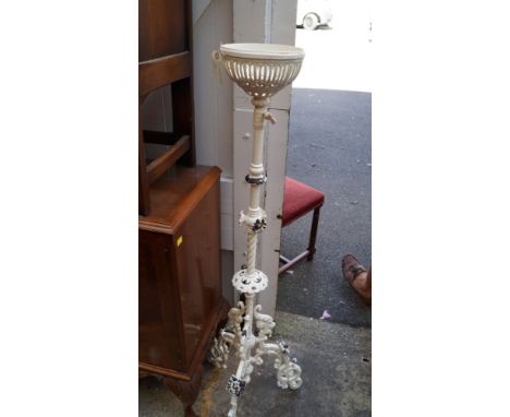 A Victorian white painted wrought iron standard oil lamp.