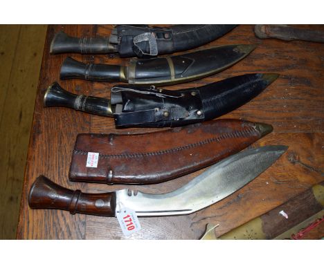 A World War II period kukri and leather sheath; together with three other kukris and sheaths. Chinese Triad sword and dagger 