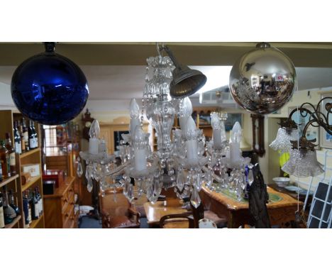 A glass twelve branch chandelier. 