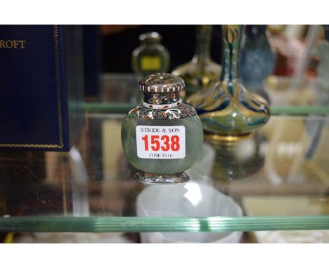 An antique green jadeite, silver gilt and champleve enamel snuff bottle, 7cm high. 
