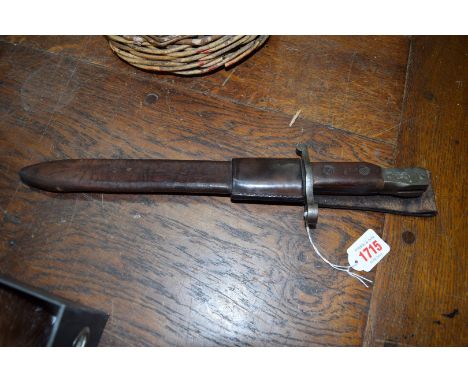 A World War I period Canadian Ross Rifle Co, Quebec bayonet, model 1905  and leather scabbard. 