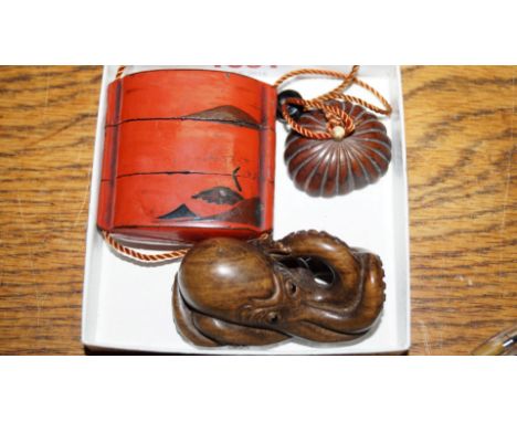 A Japanese red lacquer two case inro and cover; together with a carved wood Octopus netsuke.