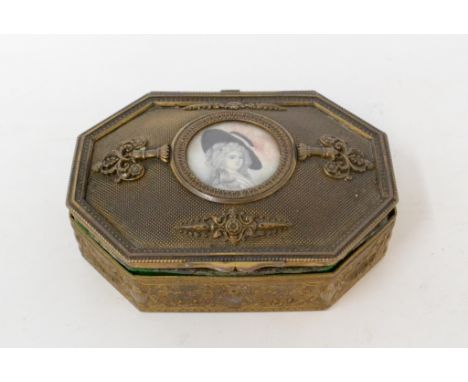 A gilt metal box and cover, the cover inset a portrait miniature of a lady wearing a feathered hat, 11 cm wide

 