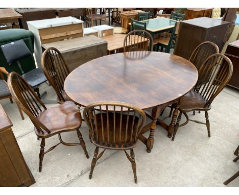 AN ARIGHI BIANCHI OAK DROP LEAF DINING TABLE (MARKED SOLID ENGLISH OAK) WITH DRAWER AND SIX MATCHING OAK STICK BACK DINING CH