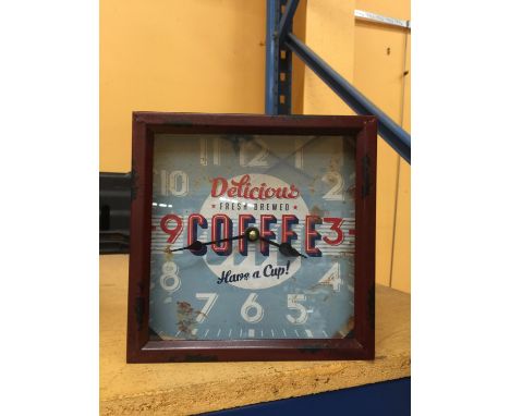 A TIN FRAMED COFFEE DESIGN CLOCK 