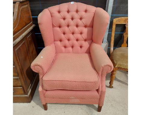 A MODERN BUTTON-BACK WINGED EASY CHAIR 