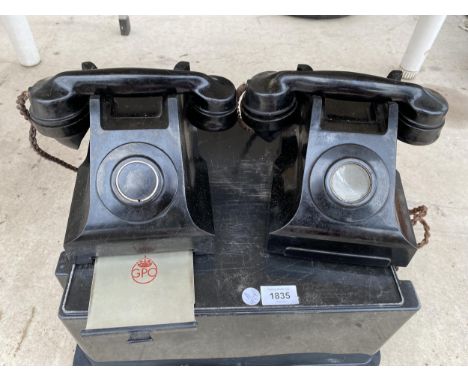 A PAIR OF VINTAGE BLACK DIAL UP TELEPHONES 
