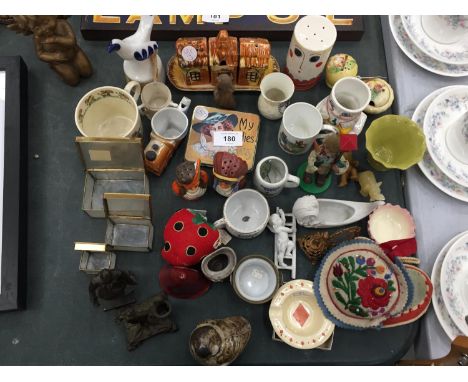 A MIXED LOT TO INCLUDE A CARLTON WARE 'FACE' PEPPER POT, SMALL CUPS AND MUGS, METAL FIGURES, A VINTAGE TIN, ROYAL WORCESTER B