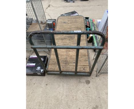 A VINTAGE WHEELED PLATFORM TROLLEY 