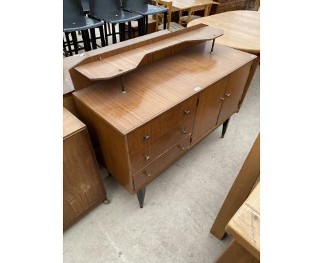 A RETRO TEAK SIDEBOARD WITH RAISED SHELF RACK, ENCLOSING THREE DRAWERS AND TWO CUPBOARDS, 48" WIDE 