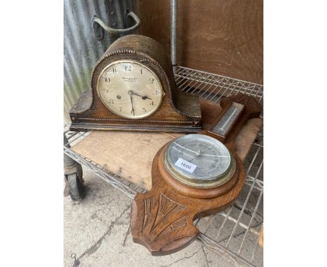 A VINTAGE WOODEN CASED BAROMETER AND A MANTLE CLOCK 
