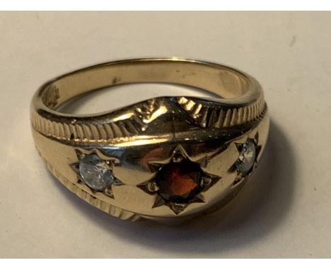 A 9 CARAT GOLD RING WITH A CENTRE GARNET AND A CLEAR STONE EACH SIDE SIZE Q/R IN A PRESENTATION BOX 