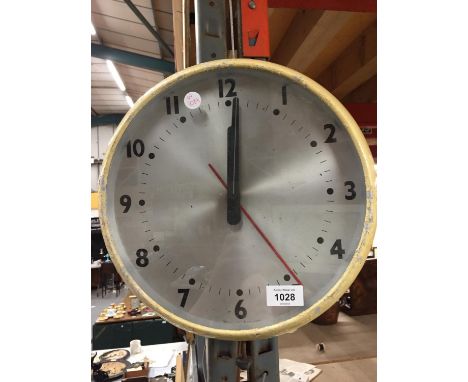 A VINTAGE ELECTRIC METAL WALL CLOCK 