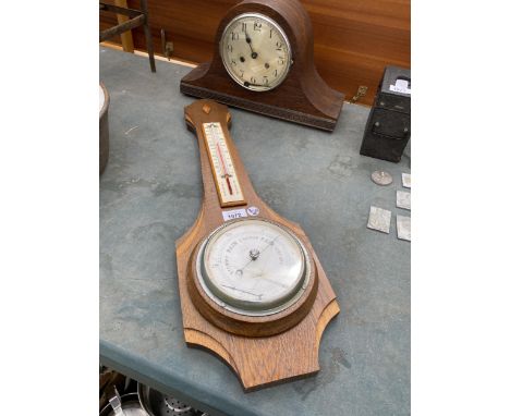 AN OAK CHIMING MANTLE CLOCK AND OAK BAROMETER 