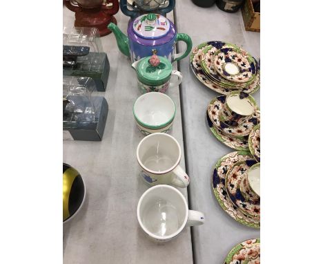 A TEA SET BY TOP DESIGNER SUSAN SITTLER TO INCLUDE A TEAPOT, CREAM JUG, SUGAR BOWL PLUS TWO MUGS 