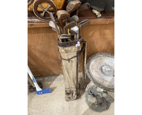 A SET OF VINTAGE WOODEN AND FURTHER GOLF CLUBS 