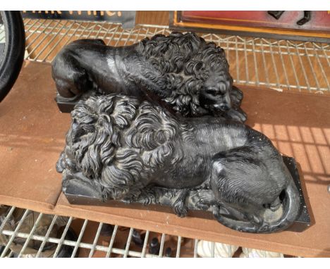 A PAIR OF VINTAGE SLEEPING LIONS 