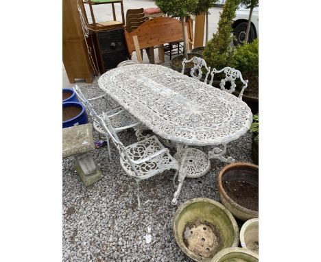 A VINTAGE COALBROOKDALE STYLE GARDEN TWIN PEDESTAL DINING TABLE AND FOUR CHAIRS 