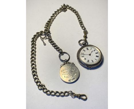 A POCKET WATCH ON A CHAIN WITH A HALLMARKED BIRMINGHAM SILVER FOB 