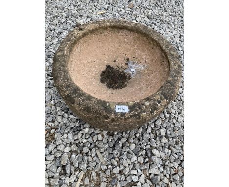 A CIRCULAR RECONSTITUTED STONE PLANTER 