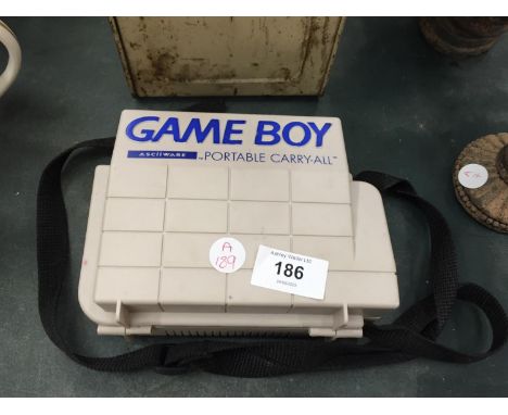A VINTAGE NINTENDO IN A PLASTIC CARRY CASE - A/F 