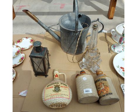 AN ASSORTMENT OF ITEMS TO INCLUDE A GALVANISED WATERING CAN, STONWARE BOTTLES AND A GLASS LAMP ETC 