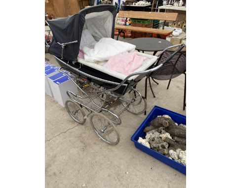 A VINTAGE SILVER CROSS PRAM 