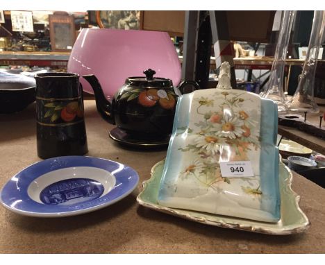 A TEAPOT, TEAPOT STAND AND JUG IN BLACK WITH ORANGES DECORATION, A VINTAGE CHEESE PLATE AND COVER AND A CARLSBERG PLATE 