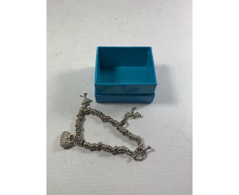 A SILVER SWEETY BRACELET WITH THREE CHARMS 