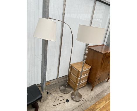 A POLISHED STEEL STANDARD LAMP COMPLETE WITH SHADE AND SIMILAR EXTENDING LAMP COMPLETE WITH SHADE 