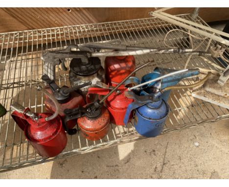 A COLLECTION OF VINTAGE OIL CANS 