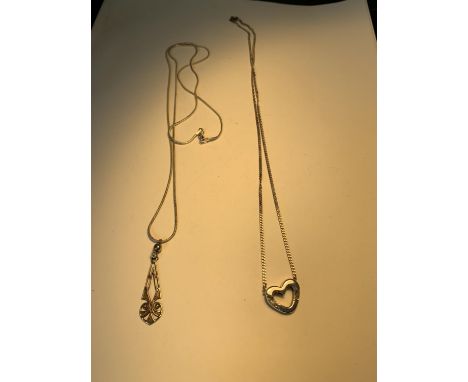 TWO SILVER NECKLACES WITH PENDANTS 