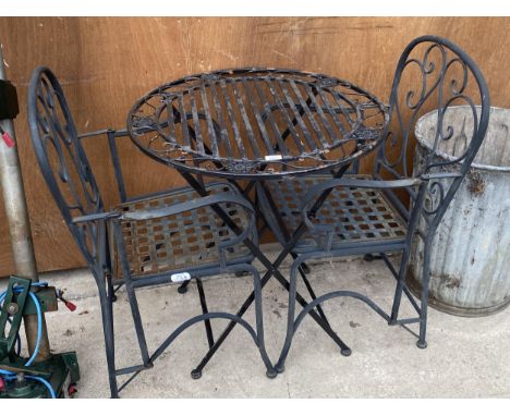 A VINTAGE METAL BISTRO TABLE AND TWO FOLDING METAL BISTRO CHAIRS 