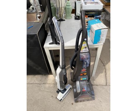 A BISSELL CARPET CLEANER AND A BOSCH STICK VACUUM 