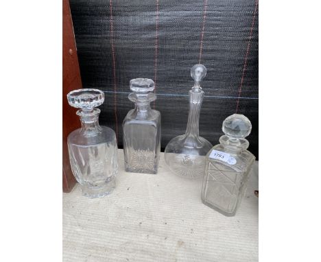 FOUR VINTAGE GLASS DECANTERS 