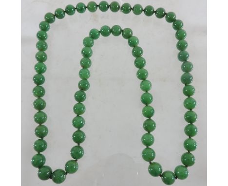 A jade coloured bead necklace