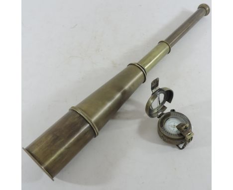 A 32 inch telescope, together with a marching compass