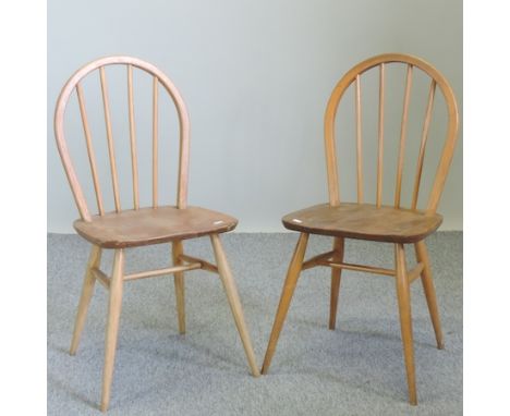 A set of four Ercol light elm spindle back dining chairs