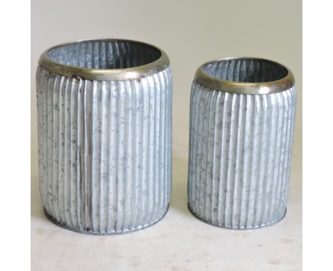 A vintage style garden planter, 35cm, together with another smaller