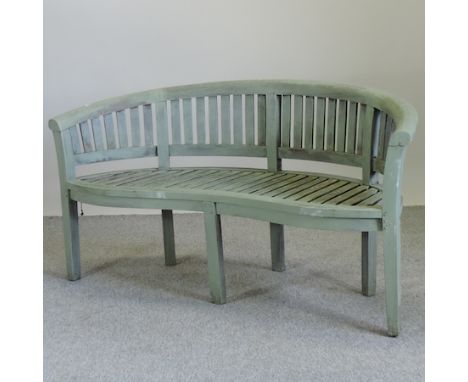 A green painted curved wooden garden bench, 160cm