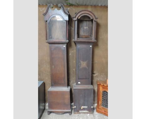 A George III oak longcase clock case, 220cm tall, together with another similar