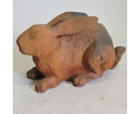 A rusted metal model of a hare, 36cm 