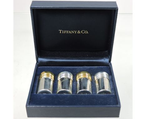 A set of Tiffany sterling silver miniature condiments, cased