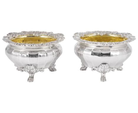 A PAIR OF GEORGE III SILVER SALT CELLARS, PAUL STORR FOR RUNDELL, BRIDGE & RUNDELL, LONDON, 1815 faceted bombé circular, cast