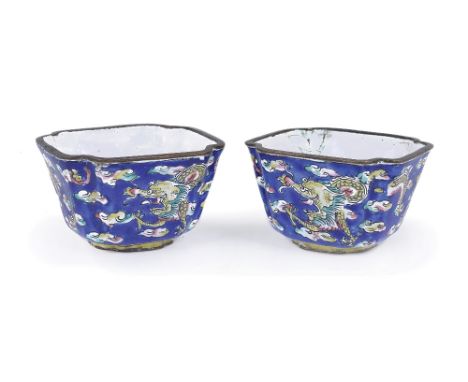 A PAIR OF CHINESE CANTON ENAMEL WINE CUPS, 19TH CENTURY with a blue ground decorated with flying dragons amongst clouds, the 