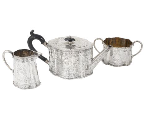 A VICTORIAN SILVER MATCHED THREE-PIECE TEA SET, LONDON & SHEFFIELD, 1865-89 shaped oval, with beaded rims, bright-cut decorat